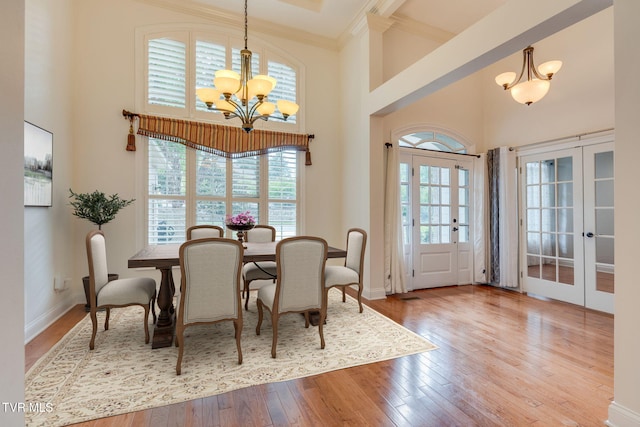 1001 Willows Trace Dr, Johnson City, TN 37601 - dining area with french doors, a chandelier, a towering ceiling, hardwood / wood-style flooring, and ornamental molding