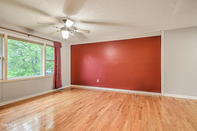 145 Linda Hts, Fall Branch, TN 37656 - spare room featuring a ceiling fan, wood-type flooring, a textured ceiling, and baseboards