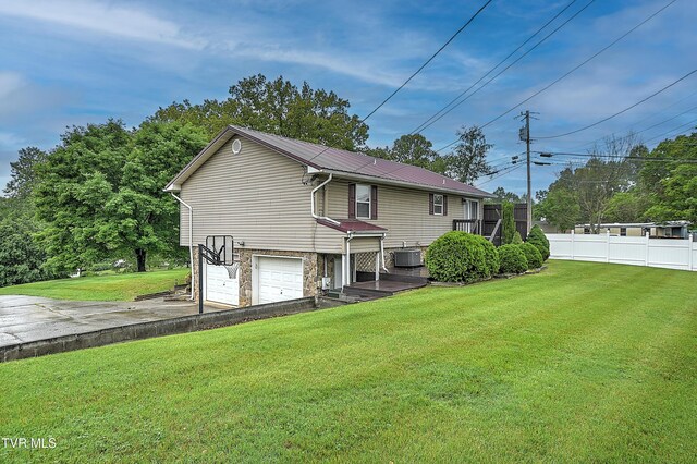 145 Linda Hts, Fall Branch, TN 37656 - rear view of house with an attached garage, driveway, metal roof, stone siding, and cooling unit