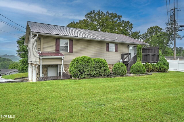 145 Linda Hts, Fall Branch, TN 37656 - rear view of property featuring a garage, metal roof, and stone siding