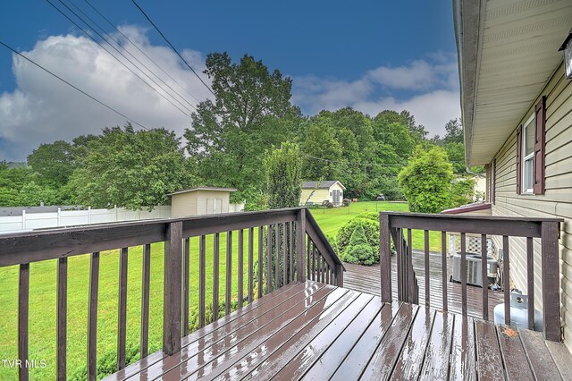 145 Linda Hts, Fall Branch, TN 37656 - wooden deck with an outdoor structure, central AC unit, and a storage unit