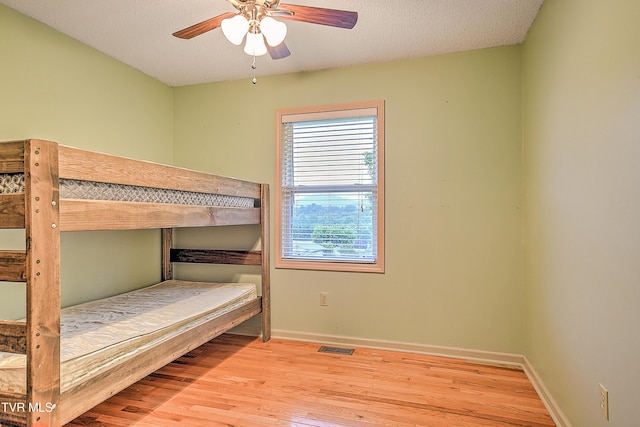 145 Linda Hts, Fall Branch, TN 37656 - unfurnished bedroom featuring wood finished floors, baseboards, and a ceiling fan