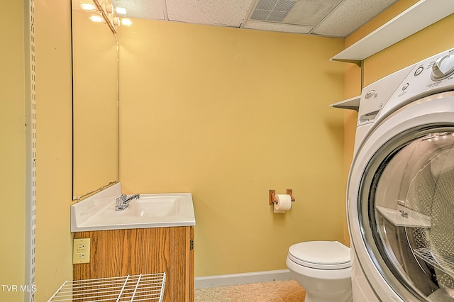 145 Linda Hts, Fall Branch, TN 37656 - bathroom with washer / clothes dryer, toilet, vanity, a drop ceiling, and baseboards