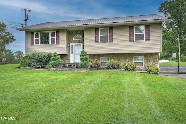145 Linda Hts, Fall Branch, TN 37656 - raised ranch with a front lawn, metal roof, and stone siding