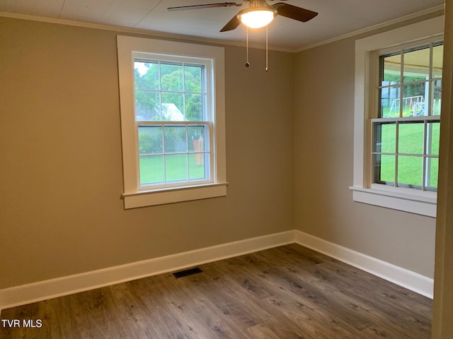 626 N Mohawk Dr, Erwin, TN 37650 - spare room featuring baseboards, healthy amount of natural light, ornamental molding, and dark wood finished floors