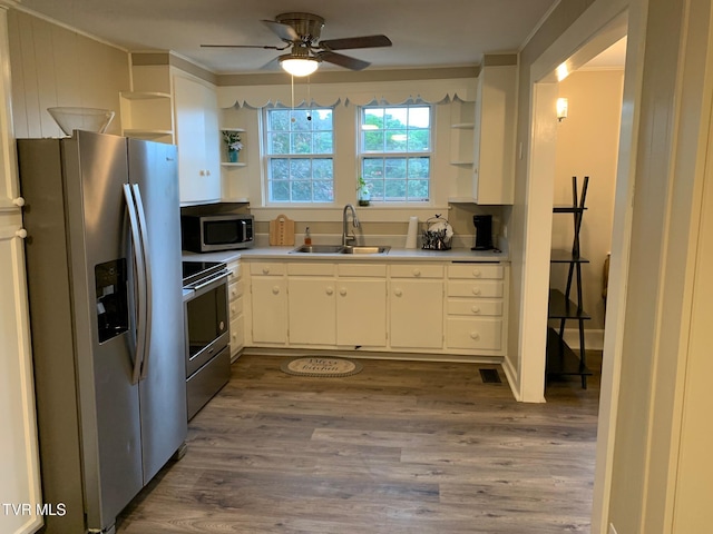 626 N Mohawk Dr, Erwin, TN 37650 - kitchen featuring open shelves, appliances with stainless steel finishes, a sink, ornamental molding, and a ceiling fan