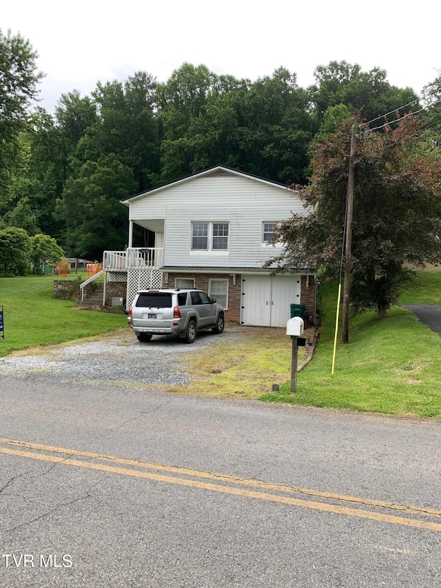 626 N Mohawk Dr, Erwin, TN 37650 - view of front of property with a front yard, stairs, and brick siding
