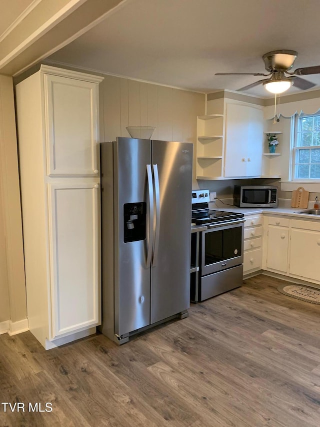 626 N Mohawk Dr, Erwin, TN 37650 - kitchen featuring appliances with stainless steel finishes, open shelves, wood finished floors, and white cabinetry