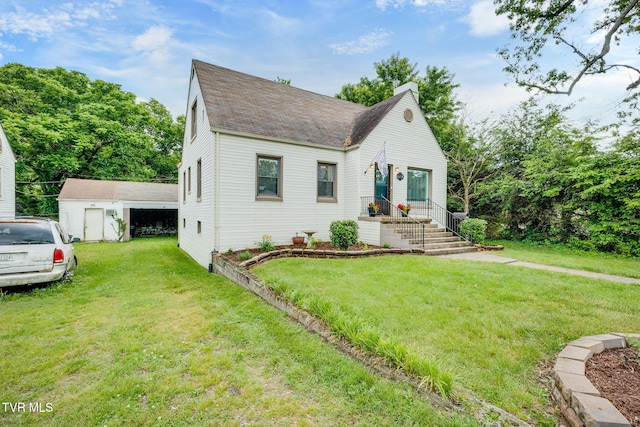 1462 Valley St, Kingsport, TN 37660 - view of front of house with roof with shingles, a front yard, and an outdoor structure