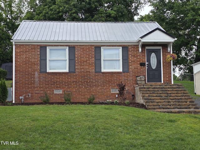 1317 Newton St, Bristol, VA 24201 - ranch-style home featuring a front yard, brick siding, metal roof, and crawl space