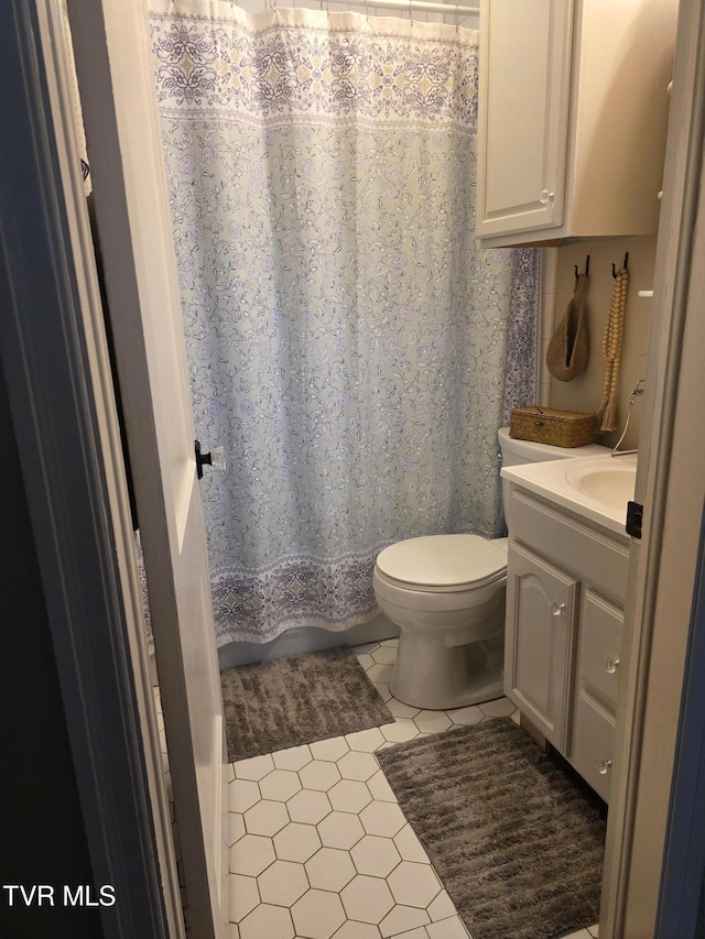 1317 Newton St, Bristol, VA 24201 - full bathroom featuring vanity, toilet, tile patterned flooring, and shower / bath combo