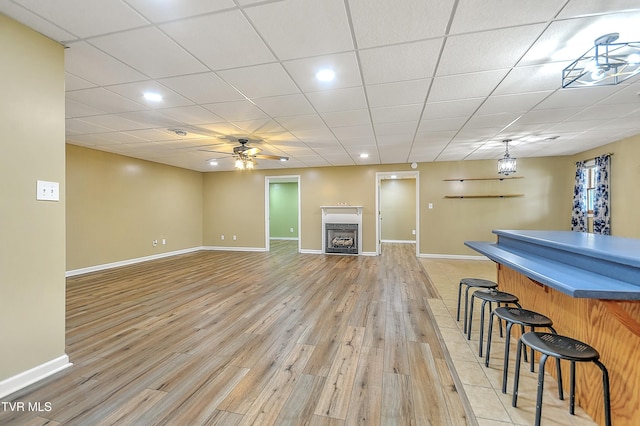 476 Sportsman Dock Rd, Piney Flats, TN 37686 - living area with baseboards, a fireplace, light wood-type flooring, a ceiling fan, and recessed lighting
