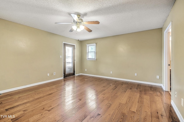 476 Sportsman Dock Rd, Piney Flats, TN 37686 - empty room featuring a ceiling fan, a textured ceiling, wood finished floors, and baseboards