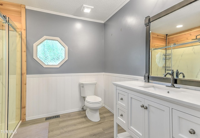 476 Sportsman Dock Rd, Piney Flats, TN 37686 - bathroom featuring wood finished floors, a marble finish shower, wainscoting, toilet, and vanity