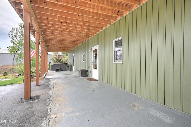 476 Sportsman Dock Rd, Piney Flats, TN 37686 - view of patio / terrace with a hot tub and an attached carport