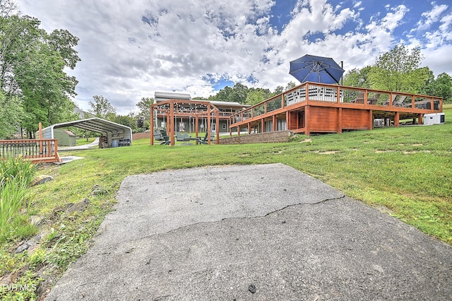 476 Sportsman Dock Rd, Piney Flats, TN 37686 - view of green lawn with a wooden deck and a detached carport