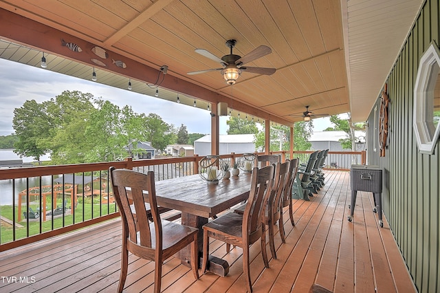 476 Sportsman Dock Rd, Piney Flats, TN 37686 - wooden terrace featuring outdoor dining area, ceiling fan, and a water view
