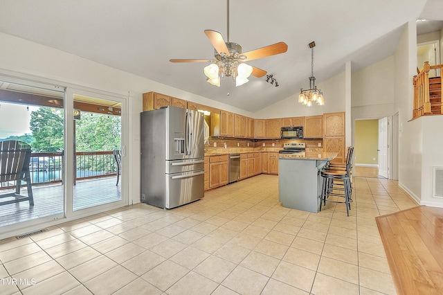 476 Sportsman Dock Rd, Piney Flats, TN 37686 - kitchen featuring appliances with stainless steel finishes, light tile patterned flooring, tasteful backsplash, ceiling fan, and lofted ceiling