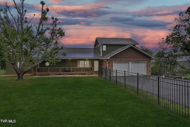 476 Sportsman Dock Rd, Piney Flats, TN 37686 - view of front facade featuring a garage, metal roof, asphalt driveway, and brick siding