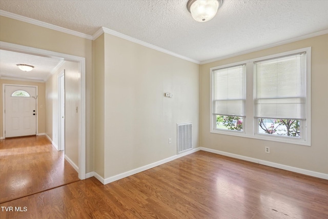 1700 Ridgeway Dr, Kingsport, TN 37664 - spare room with wood finished floors, a textured ceiling, crown molding, and baseboards