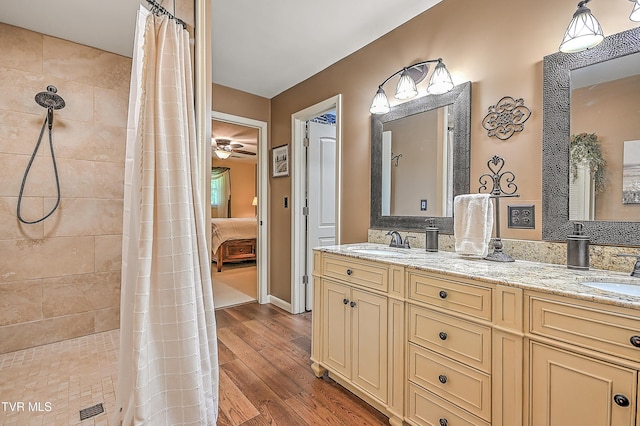 2309 Oxford Ct, Kingsport, TN 37660 - bathroom with wood finished floors, double vanity, a tile shower, and ensuite bath