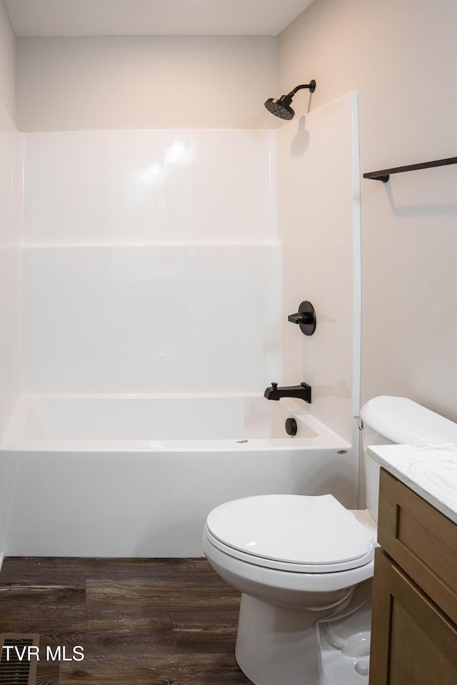 105 Ottinger Ln, Chuckey, TN 37641 - bathroom with toilet, wood finished floors, vanity, and washtub / shower combination