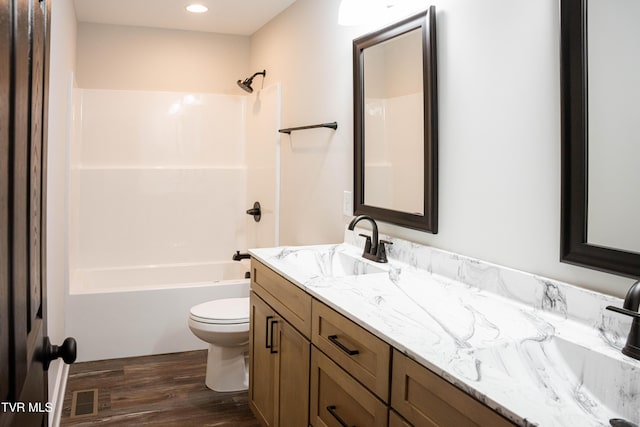 105 Ottinger Ln, Chuckey, TN 37641 - full bathroom featuring wood finished floors, toilet,  shower combination, vanity, and recessed lighting
