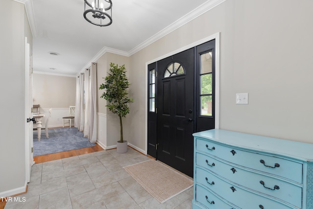 821 Regency Dr, Johnson City, TN 37604 - foyer entrance featuring ornamental molding, a chandelier, and baseboards