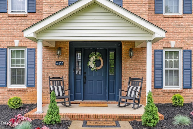 821 Regency Dr, Johnson City, TN 37604 - doorway to property with brick siding and covered porch