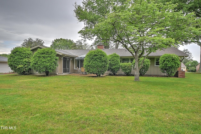 441 High Ridge Rd, Kingsport, TN 37660 - rear view of property featuring a chimney, a yard, board and batten siding, and roof with shingles