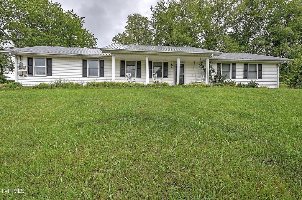 18505 Ironwood Loop, Abingdon, VA 24210 - ranch-style house with a porch, a front lawn, and metal roof