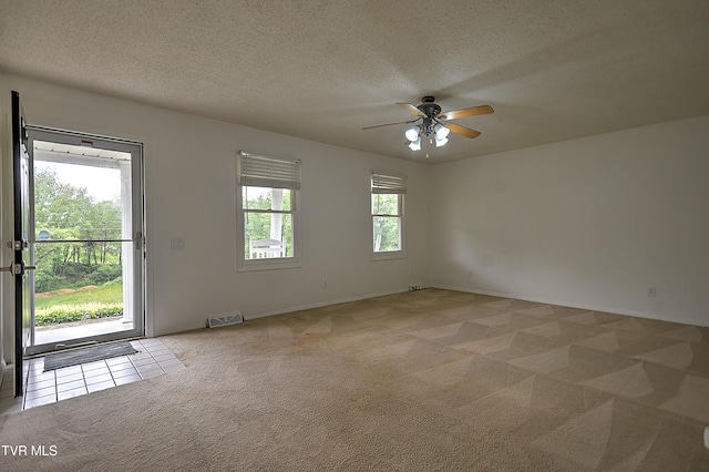 18505 Ironwood Loop, Abingdon, VA 24210 - unfurnished room with light colored carpet, a ceiling fan, a textured ceiling, and baseboards