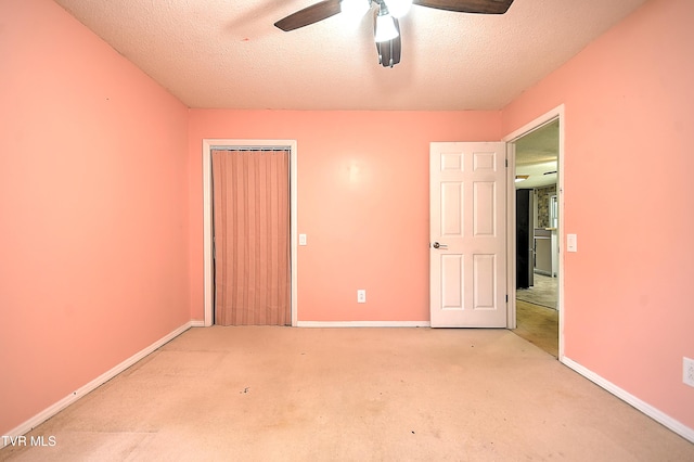 18505 Ironwood Loop, Abingdon, VA 24210 - unfurnished bedroom featuring light carpet, baseboards, a closet, a textured ceiling, and a ceiling fan