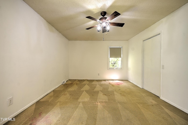 18505 Ironwood Loop, Abingdon, VA 24210 - unfurnished bedroom featuring carpet, a textured ceiling, a ceiling fan, and baseboards