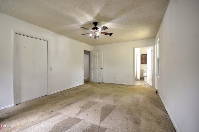 18505 Ironwood Loop, Abingdon, VA 24210 - unfurnished bedroom featuring light carpet, a textured ceiling, ensuite bathroom, baseboards, and a ceiling fan