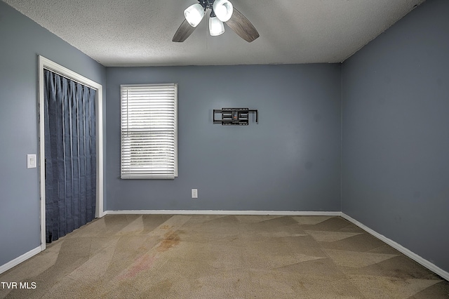 18505 Ironwood Loop, Abingdon, VA 24210 - unfurnished bedroom with carpet floors, baseboards, a textured ceiling, a closet, and a ceiling fan