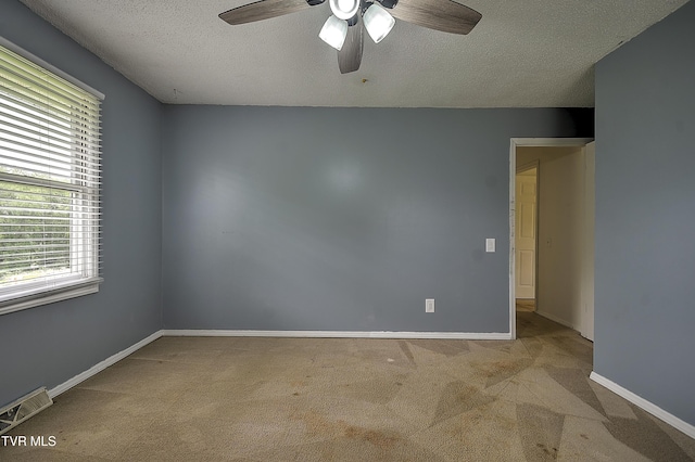 18505 Ironwood Loop, Abingdon, VA 24210 - carpeted empty room featuring ceiling fan, a textured ceiling, and baseboards