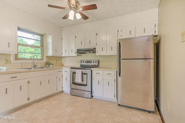 kitchen with stainless steel appliances, under cabinet range hood, a sink, and white cabinetry