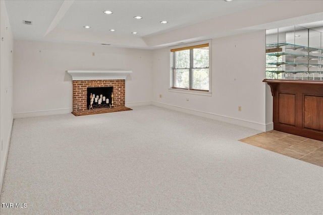 121 Queensgate, Bristol, TN 37620 - unfurnished living room with light carpet, recessed lighting, a brick fireplace, and a tray ceiling
