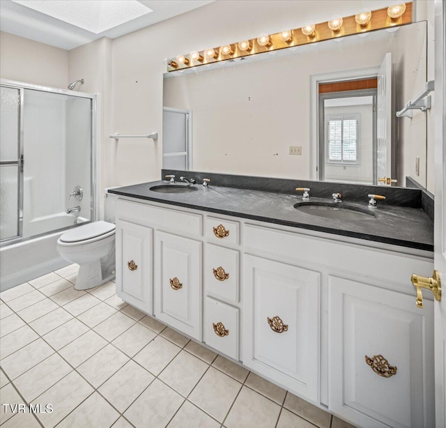 121 Queensgate, Bristol, TN 37620 - full bath with tile patterned floors, double vanity, bath / shower combo with glass door, and a skylight