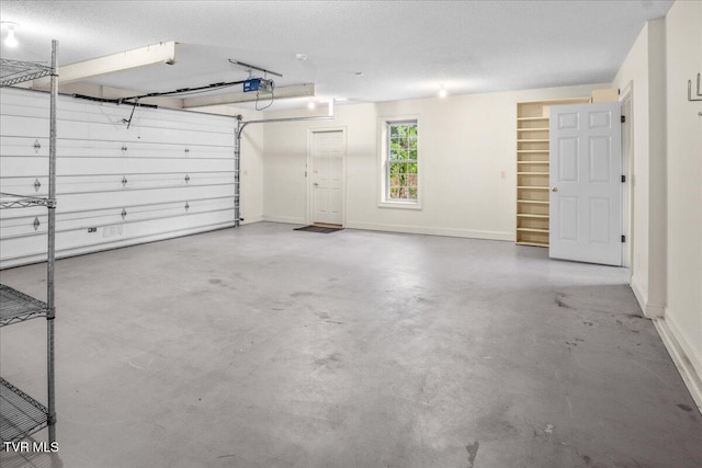 121 Queensgate, Bristol, TN 37620 - garage featuring baseboards and a garage door opener