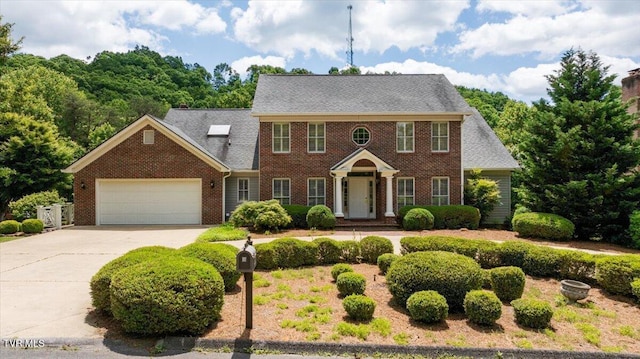 121 Queensgate, Bristol, TN 37620 - colonial home with brick siding, concrete driveway, and a garage