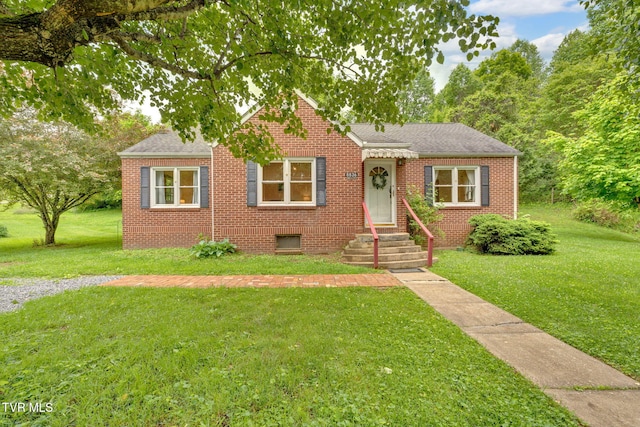 8836 Bristol Hwy, Hiltons, VA 24258 - view of front facade with a front yard, brick siding, and a shingled roof