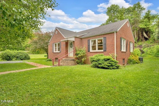 8836 Bristol Hwy, Hiltons, VA 24258 - view of front of property with brick siding, a front lawn, and a shingled roof