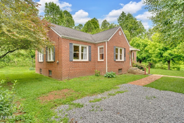 8836 Bristol Hwy, Hiltons, VA 24258 - view of side of home featuring brick siding, a yard, and a shingled roof
