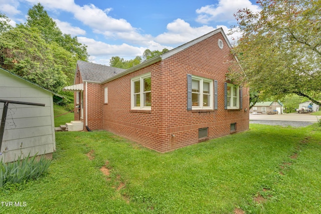 8836 Bristol Hwy, Hiltons, VA 24258 - view of side of property with brick siding, a yard, and roof with shingles