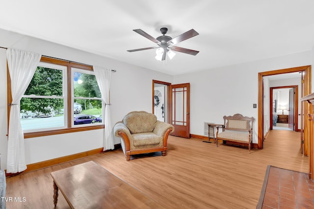 8836 Bristol Hwy, Hiltons, VA 24258 - living area with baseboards, light wood-style floors, and a ceiling fan