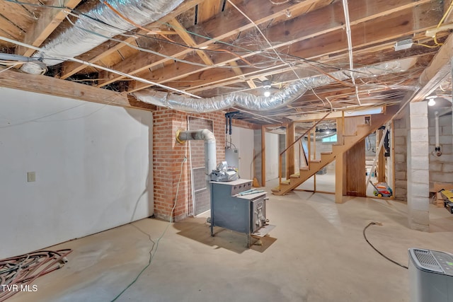 8836 Bristol Hwy, Hiltons, VA 24258 - unfinished below grade area featuring a wood stove and stairs