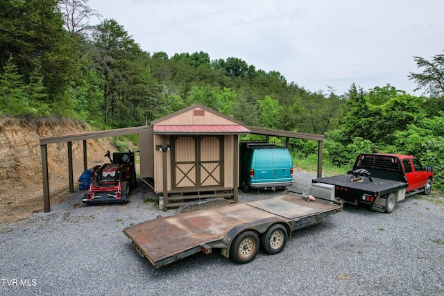 558 Oakland Dr, Bybee, TN 37713 - view of outdoor structure with a forest view and a carport