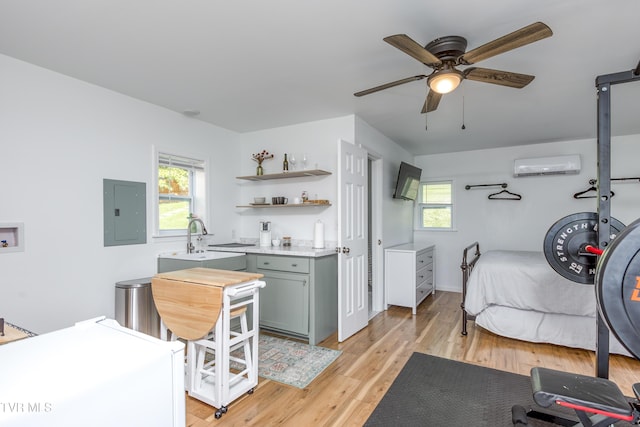 963 NE Woodlawn Ter, Abingdon, VA 24210 - bedroom with electric panel, a wall mounted AC, a sink, and multiple windows